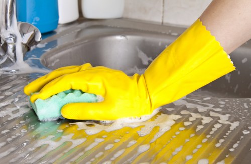 Professional cleaner handling house cleaning in a Chelsea apartment